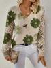 Women's Off-White V-Neck Knit Sweater with Blue Floral Pattern and Lace-Up Sleeve Detail