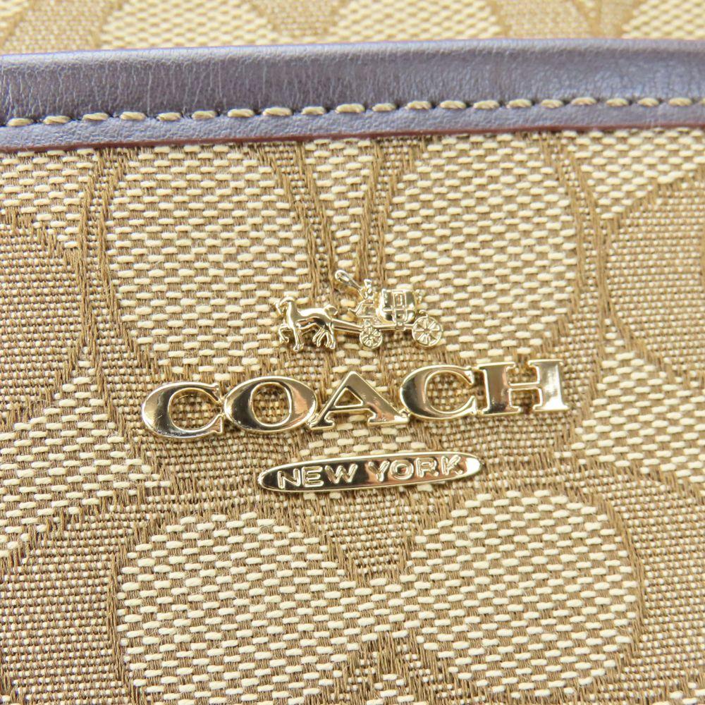 Gebrauchte COACH Umhängetasche F58285 Signature Canvas/Leder beige Dunkelbraun Diagonal getragen