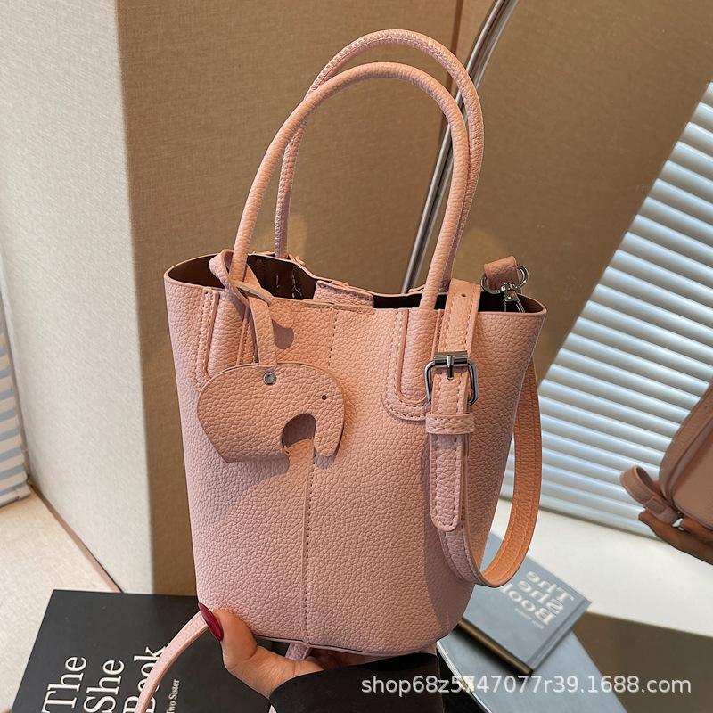 Korean simple style portable bucket bag women's 2025 summer new fashionable and popular one-shoulder crossbody vegetable basket bag