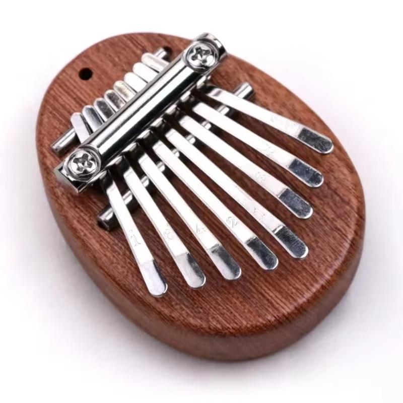 

Mini Kalimba Thumb Piano with 8 Wooden Keys, a Delicate Finger Piano with a Strap, Perfect As a Gift for on Valentine S Day