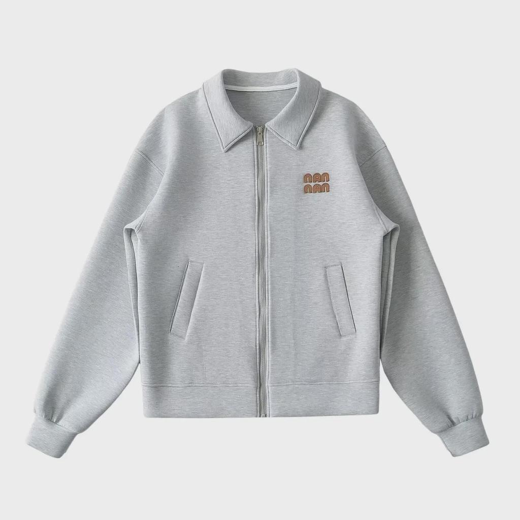 "Sweet Sports Style Mini Skirt: Elastic Waist, Air Layer Embroidery, Anti-Exposure, Versatile Sweater Material for Women."