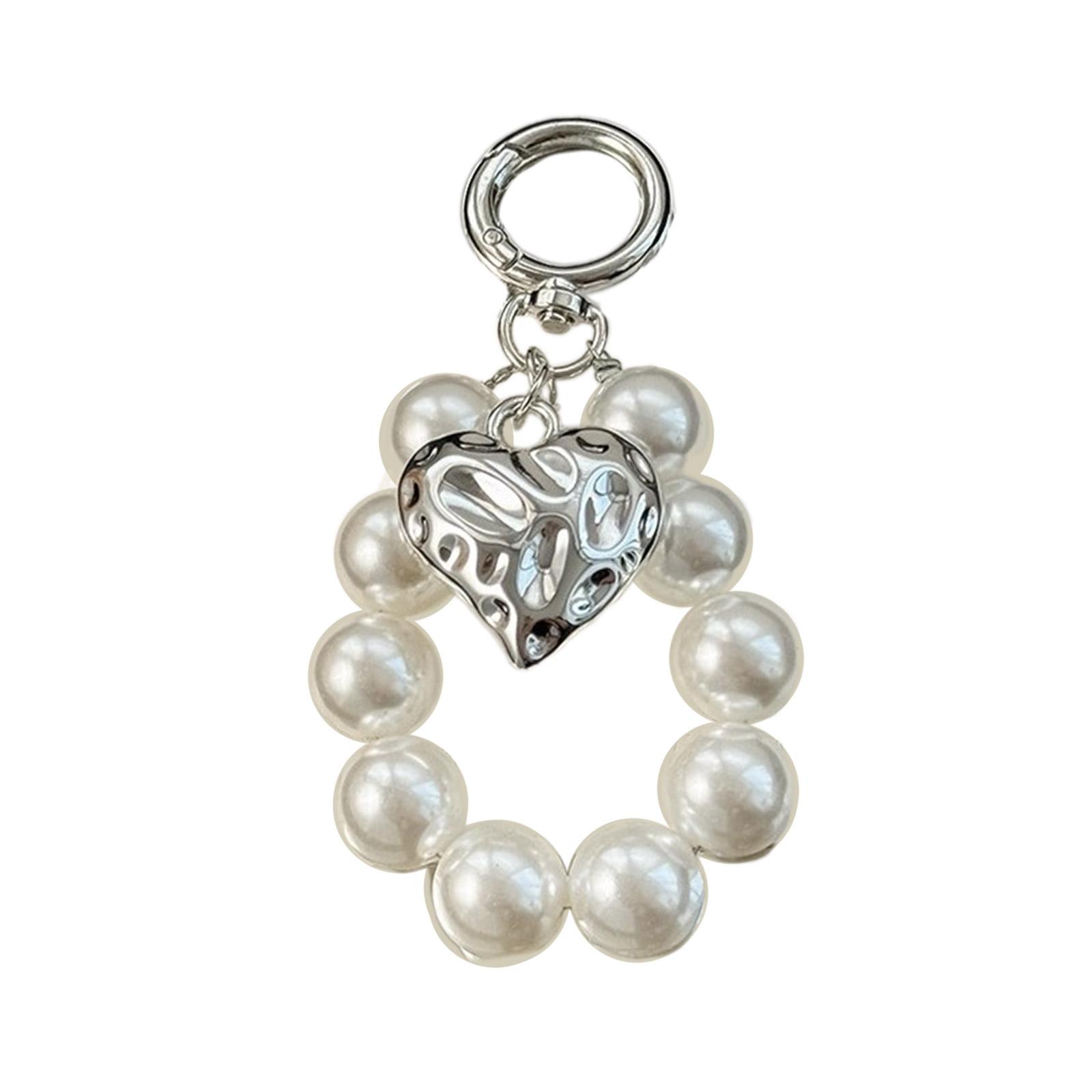 

Елегантний брелок із штучними перлами та бантом. Брелок із акриловими намистами. Модна підвіска для сумок і рюкзаків.