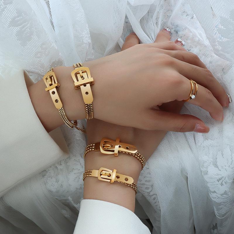 Damski pozłacany 18-karatowym złotem zegarek bransoletka ze stali tytanowej z skórzaną klamrą i łańcuszkiem pudełkowym z koralikami ryżowymi