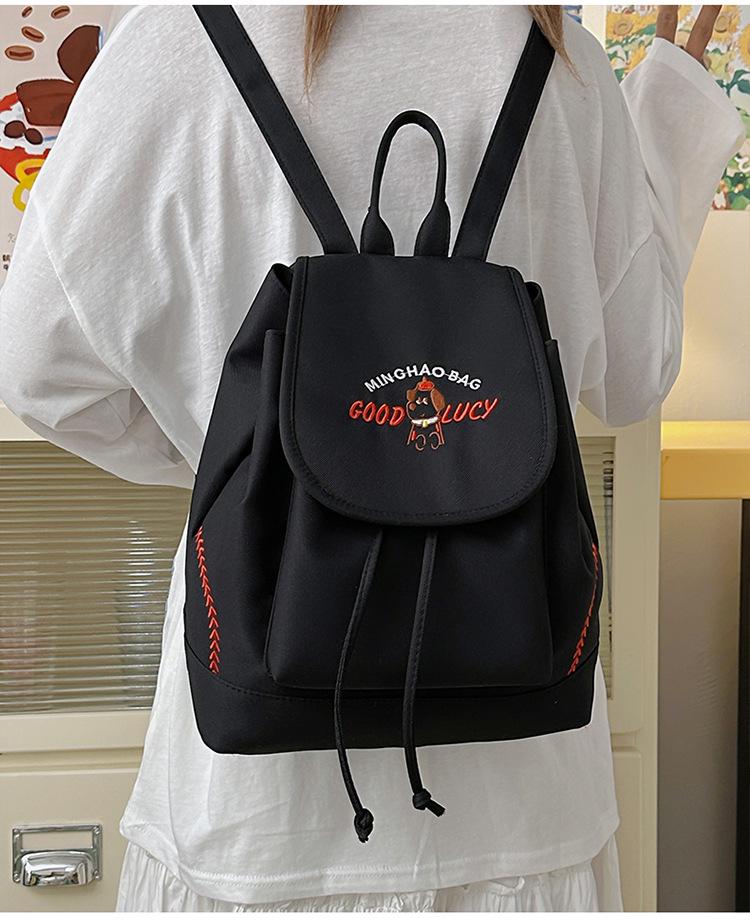 Japanese Student Casual Backpack with Embroidered Puppy Design, Drawstring Closure, and Matching Small Bag for Daily Use.