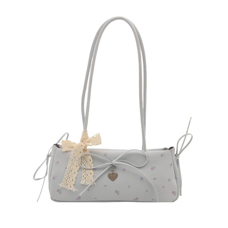 

Spring and summer fresh print women s new commuter bow fashion portable baguette shoulder armpit bag синій