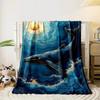 A golden-accented whale swimming in swirling blue waves under a gold sun. for all seasons blanket lunch break throw gift