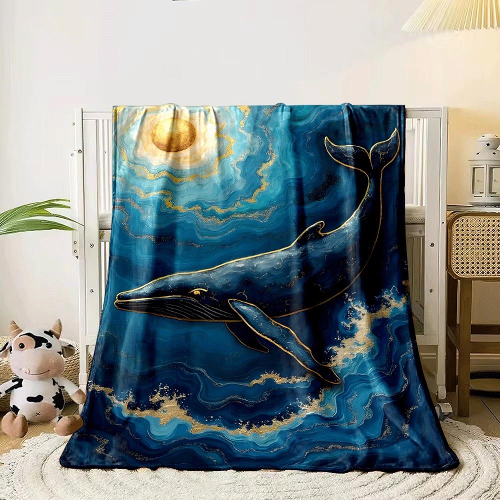 A golden-accented whale swimming in swirling blue waves under a gold sun. for all seasons blanket lunch break throw gift