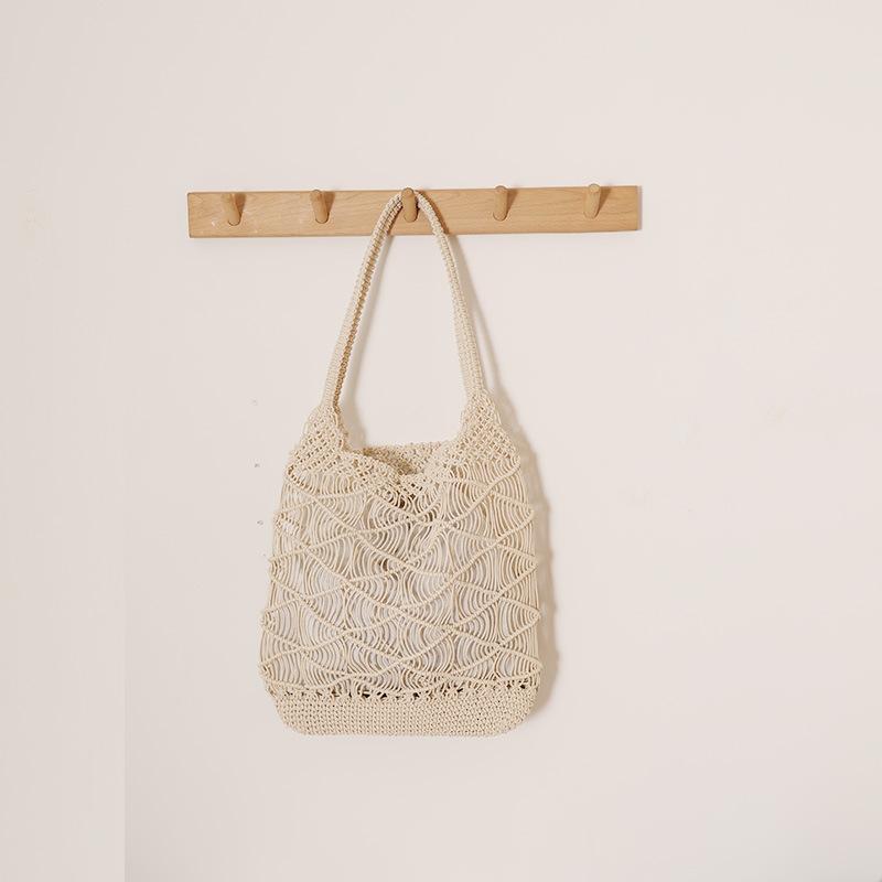 Solid color casual shoulder hollow woven bag women s new large-capacity versatile straw woven bag seaside vacation wind beach bag