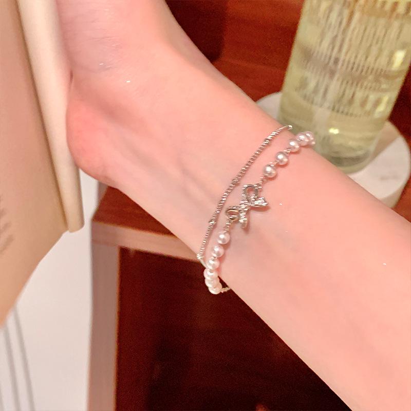 Elegant Silver Bow Double-Layer Pearl Bracelet - High-End, Versatile, Stackable Fashion Accessory