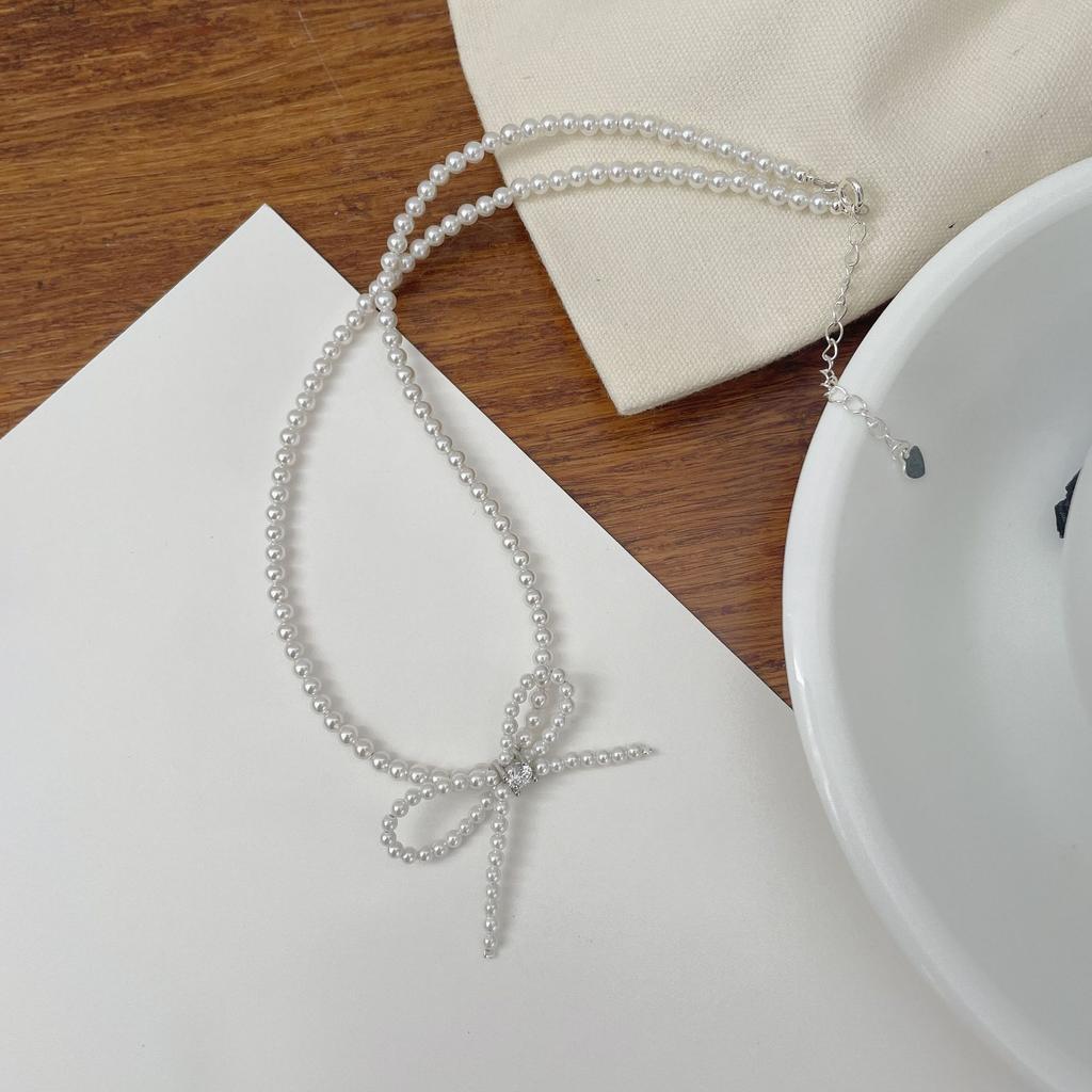 Simple and stylish S925 Temperament bow imitation pearl stud earrings women's zirconium necklace jewelry