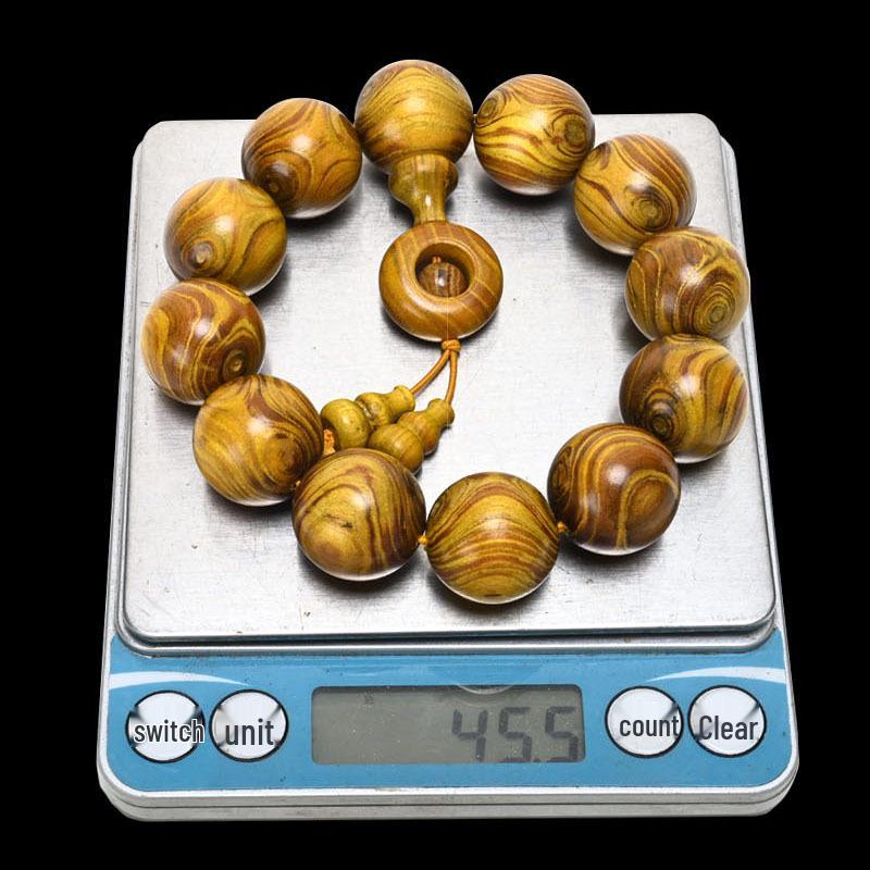 Exquisite Double-Eye Ghost Face Gold Thread Buddhist Bead Bracelet In Premium Wood