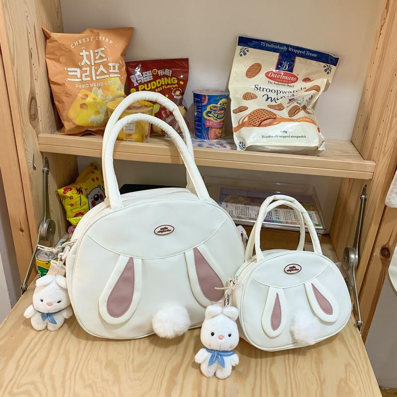 Tasche neue Umhängetasche Schultertasche koreanische Version Puppenanhänger niedliches Kaninchen Plüschtasche Canvas große Kapazität Handheld Tide