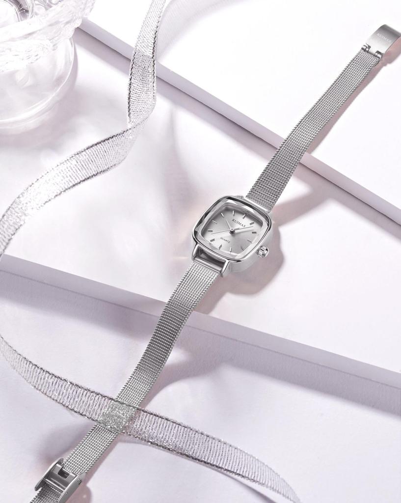 waterproof watch with a thin silver mesh strap and fashionable quartz Women's small, simple, movement.