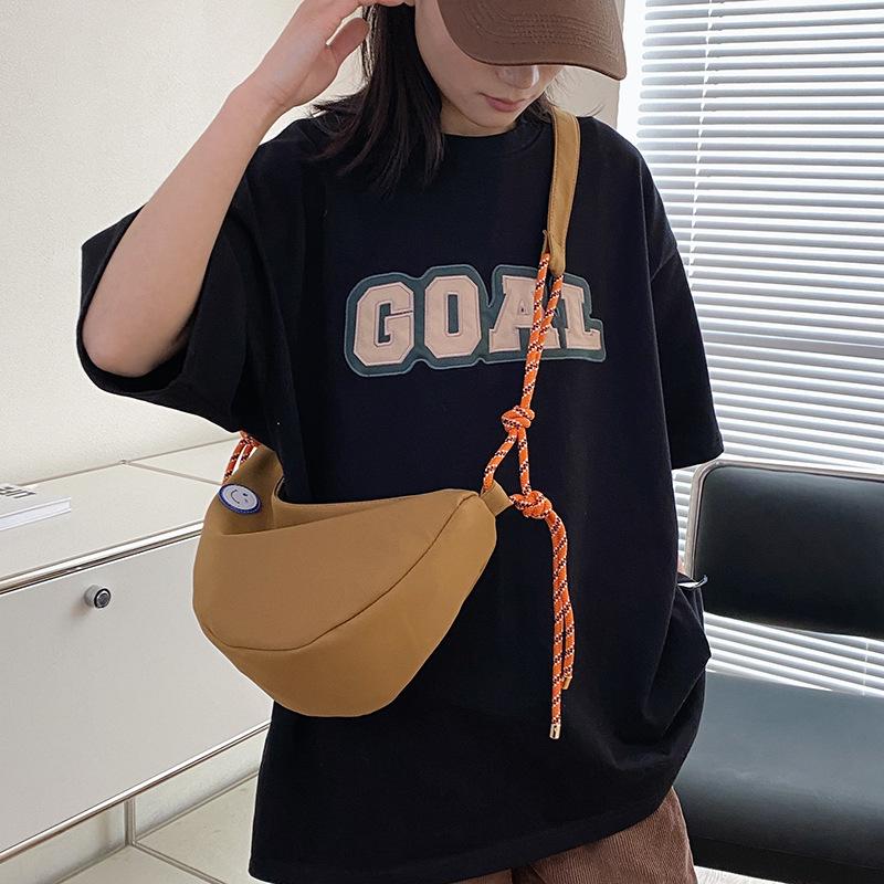 Simple dumpling bag casual 2025 new student schoolbag men's and women's shoulder messenger bag