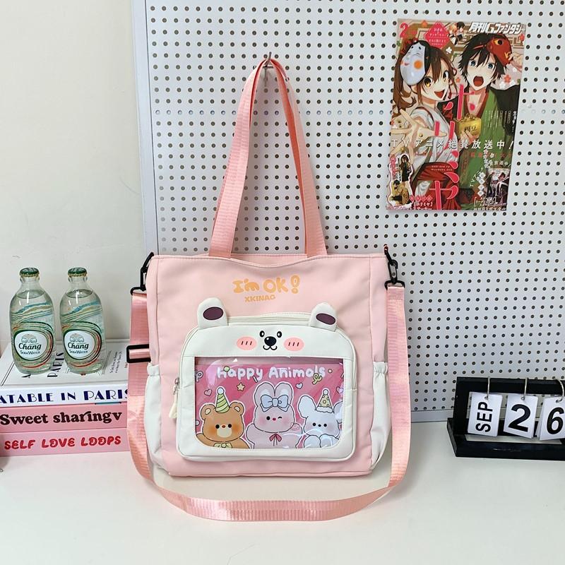 

Модная универсальная холщовая сумка-тоут с мультяшным принтом большой вместимости, повседневная портативная сумка-мессенджер для занятий и репетиторства розовый