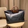 Xiangjia Large-Capacity Waterproof Oxford Travel Tote Bag, Lightweight and Foldable.