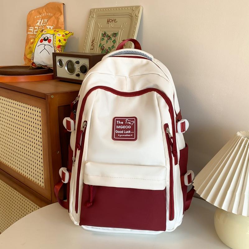 

School bag male college students contrasting color splicing couple backpack 2025 new multi-layer primary and secondary school students backpack single package червоний
