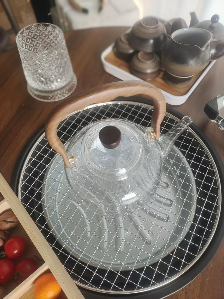 New glass teapot for brewing tea, suitable for home use on a high-temperature resistant electric ceramic stove, with handle and