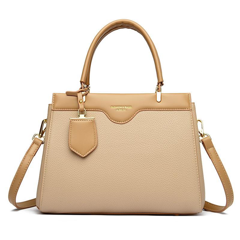 Neue minimalistische und vielseitige Damen-Handtasche mit großem Fassungsvermögen und hochwertigem Gefühl für den täglichen Weg zur Arbeit. Schultertasche kann schräg getragen werden