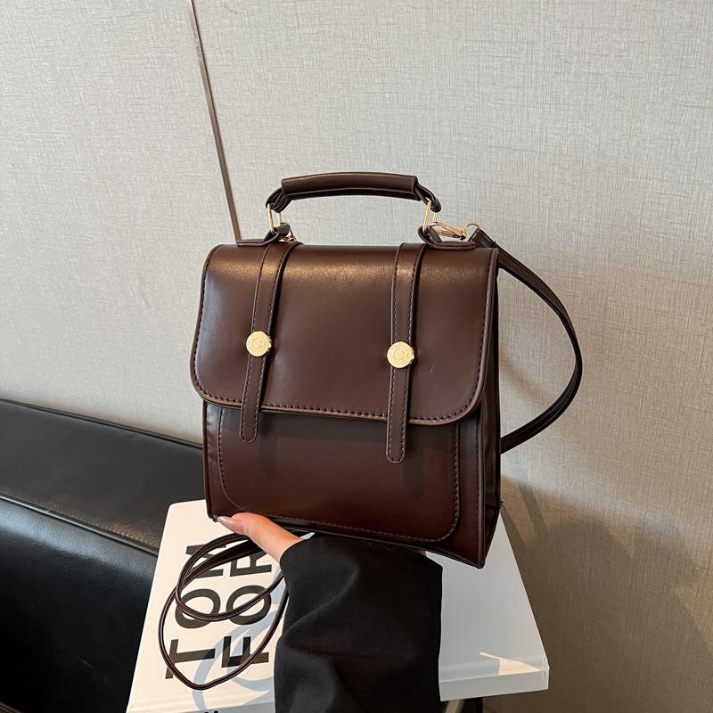 

British style retro backpack women s 2025 new autumn and winter fashion college style commuter bag niche hand shoulder bag