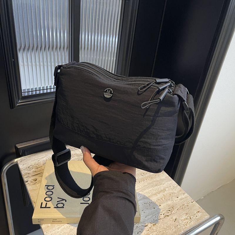 

Casual versatile backpack New lightweight women s shoulder bag Fashion three-layer women s bag Crossbody nylon bag 23*10*17cm чорний