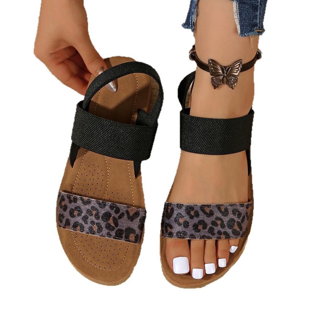 Sommer 2025 neue europäische und amerikanische Leopardenmuster flache Sandalen Damen vielseitig runde Zehen bedecken Füße tragen Strandsandalen