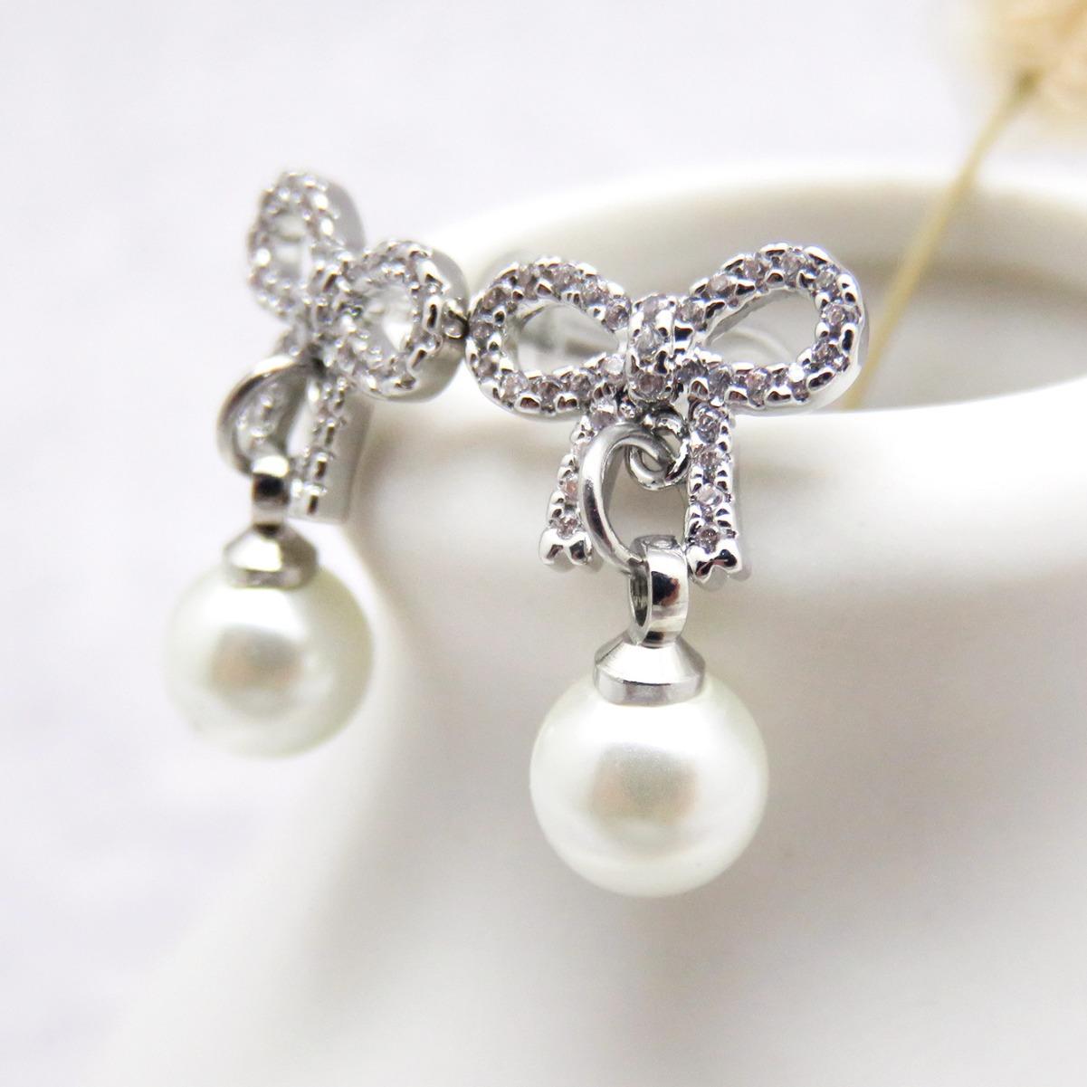 

Высококачественные элегантные и универсальные серьги-гвоздики с цирконием в виде банта и жемчуга для женщин