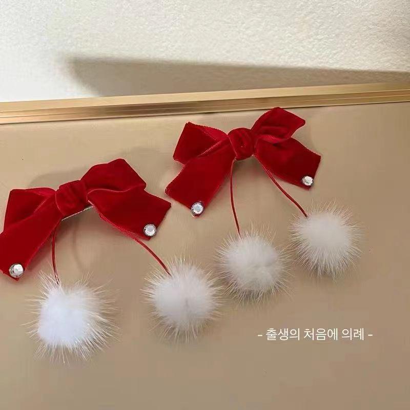 

Детская заколка-бант в форме сердца с кисточкой