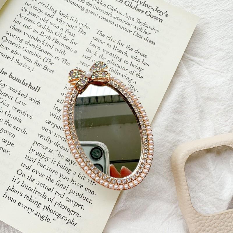 

Diamond Bow Oval Mirror Sticker Phone Airbag Holder Back Extendable Portable Touch Up Ins