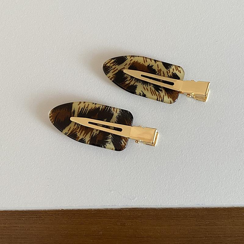 Korean version of retro fashionable leopard print seamless oval hairpin personalized versatile makeup edge clip hair accessories