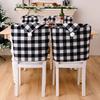 And Cozy Black White Checkered Christmas Chair Slipcover With Stylish Pom Poms For Holiday Atmosphere