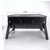 Grote opvouwbare draagbare zwarte BBQ-barbecuegrill buiten houtskoolreispicknick