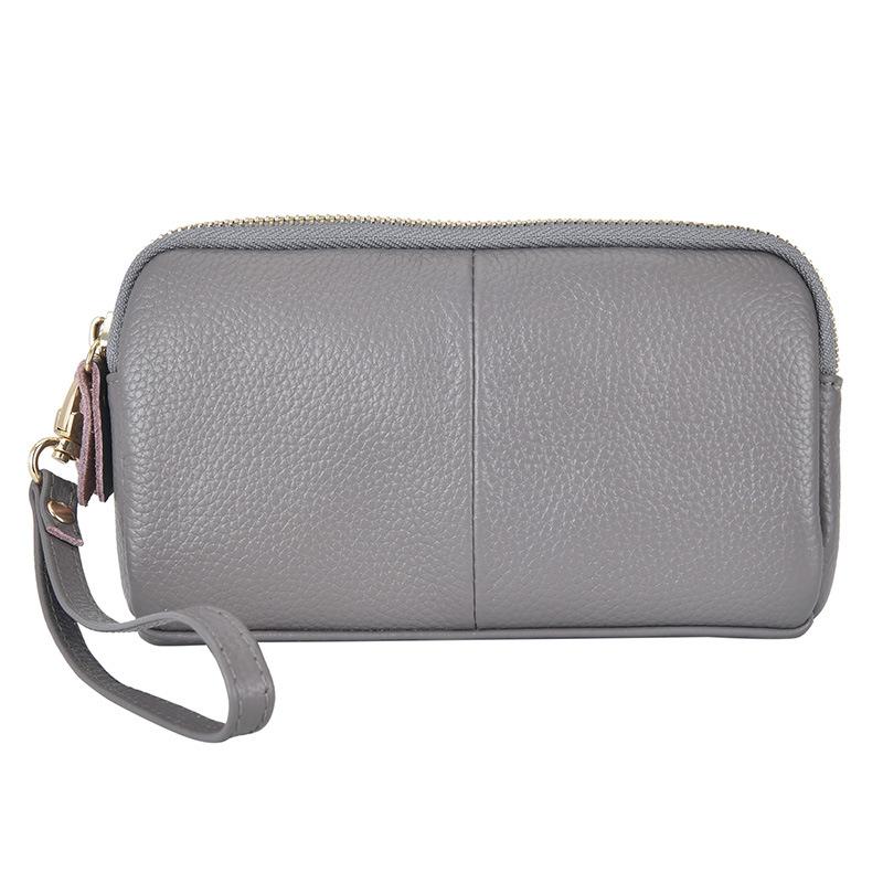 One piece is sent on behalf of the first layer of cowhide clutch bag, new trendy and fashionable women's medium mother bag wallet.