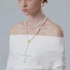 Gradient Pearl Necklace for Women - French Luxury Niche Design, Versatile Long OT Buckle Sweater Chain.