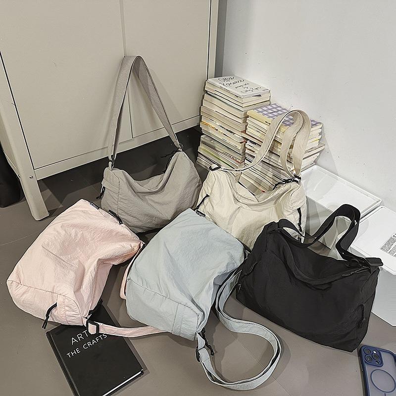 Crossbody bag New couple casual mailman bag Large capacity short trip bag Sports shoulder bag