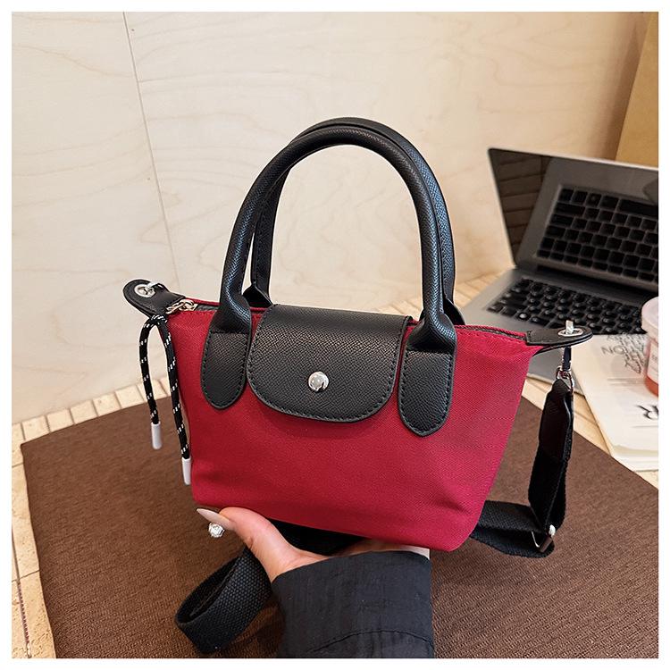 Minimalist Color-Block Oxford Cloth Handbag: Versatile, Fashionable Shoulder Bag with Unique Texture.