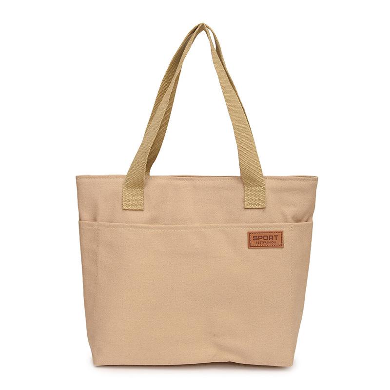Women's Versatile Canvas Tote - Lightweight, Large Capacity, Single Shoulder or Handheld Bag for Students and Commuters.