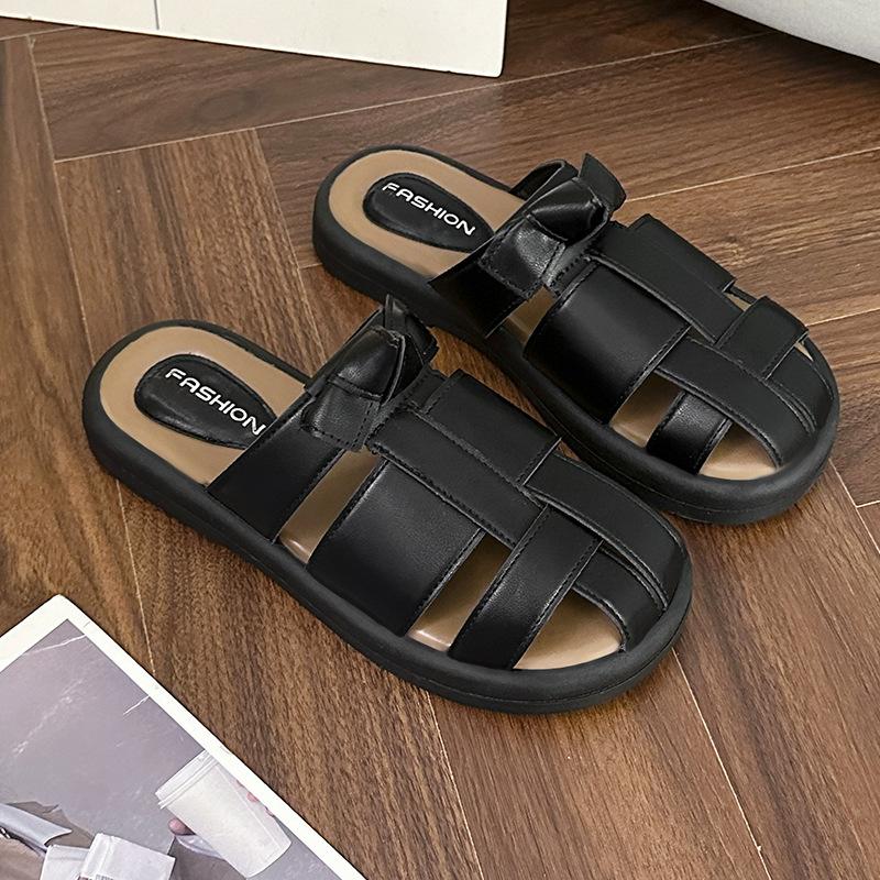 

French baotou half slippers women s 2025 summer new woven hollow Roman flat black outer pig cage sandals 40 чёрный