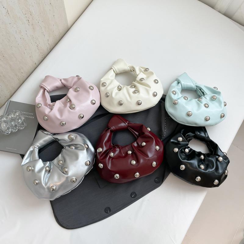 Internet celebrity armpit bag 2025 new Korean version fashion rivet shoulder bag women's versatile pearl hand carrying dumpling bag tide