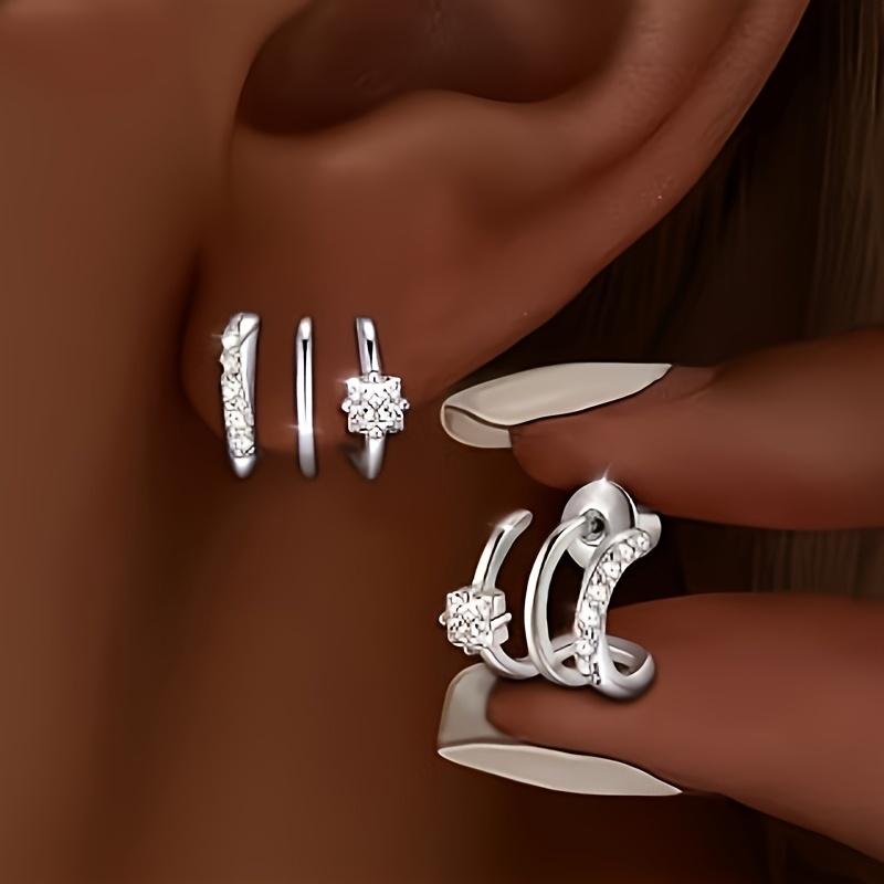 

Triple-arc hypoallergenic earrings with silver accents. Minimalist daily wear, perfect gift for women.