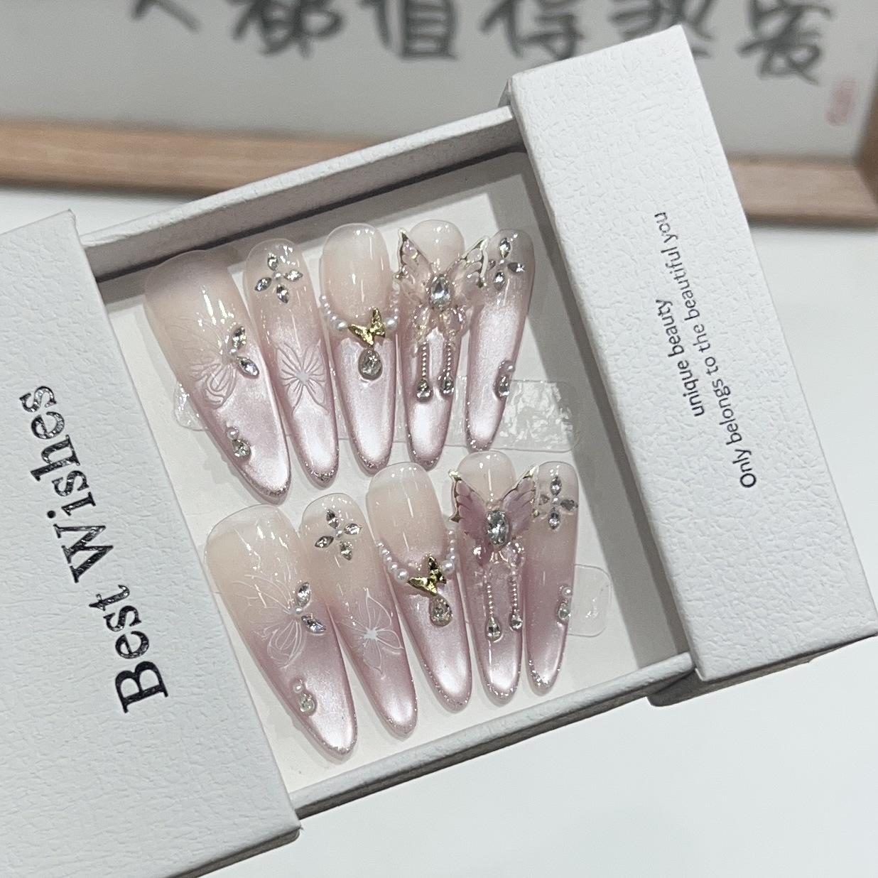 

Zhuang Zhou Butterfly Dreams: Pink Cat Eye French Tip Long False Nails with Crushed Diamond & Butterfly Designs