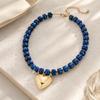 Adjustable Beaded Pendant Necklace with Rounded Resin Beads, Heart-Shaped Center Pendant, Extension Chain, and Lobster Clasp
