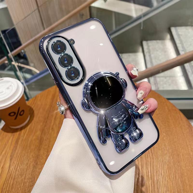 Astronaut Stand Suitable for Samsung S24ultra Mobile Phone Case S23Plus Gradient Flash Powder S22 Astronaut
