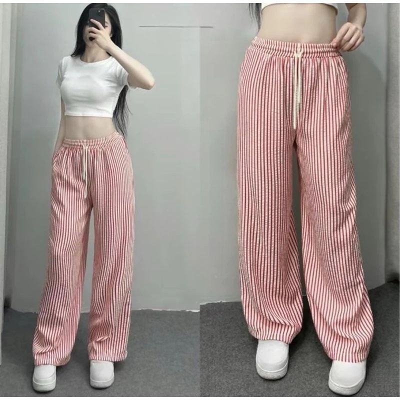 

Spring and summer style three-dimensional waist vertical stripe pants, elastic waist straight pants, summer thin ice silk wide-leg pants for women M розовый