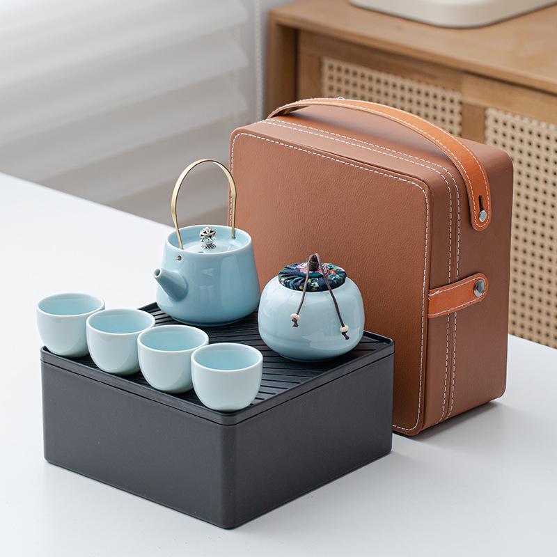 Portable Ceramic Kung Fu Tea Set: Teapot with Handle and Four Cups for Travel and Business Gifting