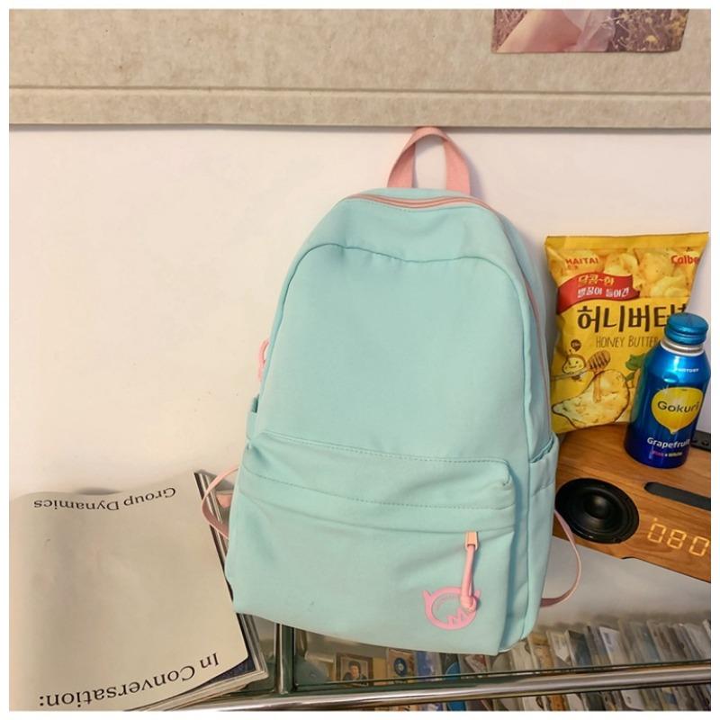 

Contrasting color simple casual schoolbag junior high school college student large-capacity backpack to reduce the burden of ridge backpack tide single package
