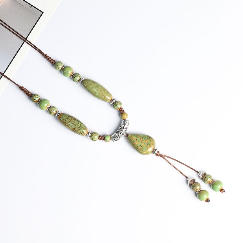 

Подвеска Ципао в древнем стиле, Цзиндэчжэньская керамика, династия Хань Floral glaze green