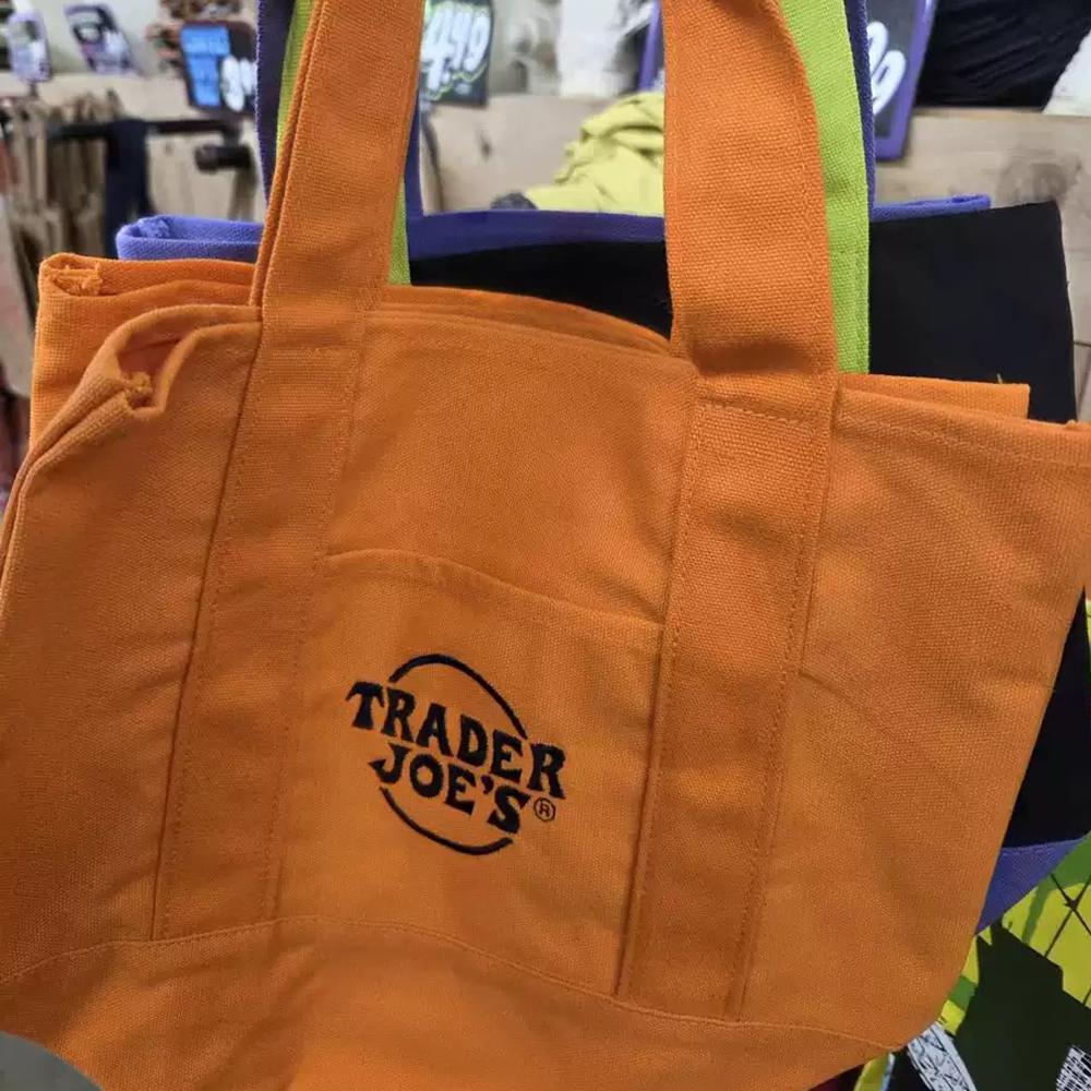 Official Trader Joe's Trick or Treat Tote Bag - Halloween Canvas Shopping Bag with Side Pocket for Groceries Pumpkin Patch