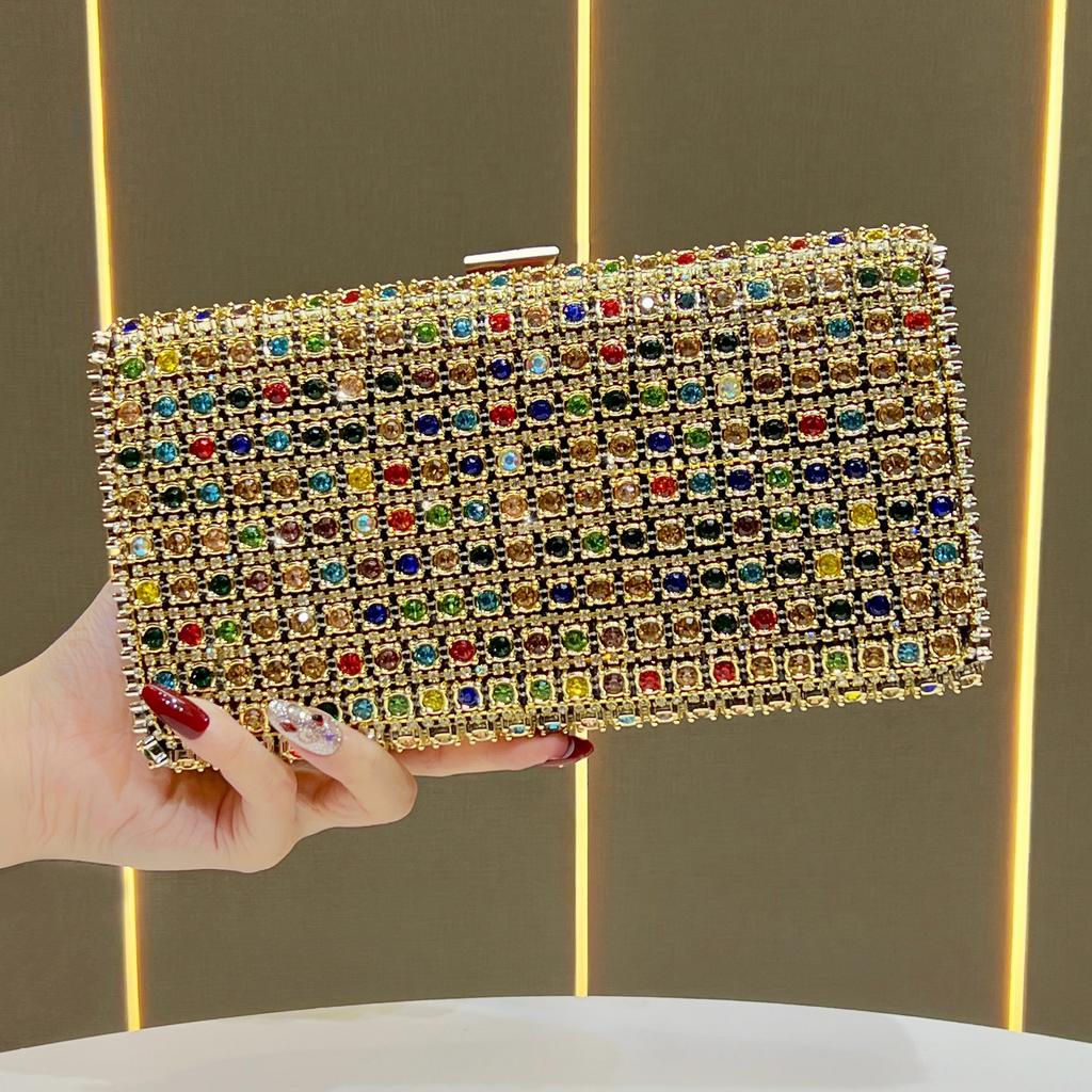 Lady Holding A Fashionable Evening Bag. Designer Water Droplet Chain Handbag for Ladies. Shoulder Bag for Ladies. Casually