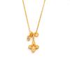 Gold hollow four-leaf flower necklace, a delicate and luxurious piece with a unique design, perfect for pairing with sweaters